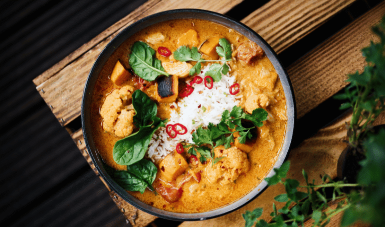 Bowl of Coconut curry with Spinach.
