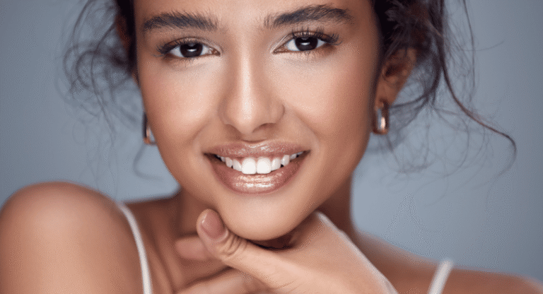 Close up of a radiant young woman smiling.